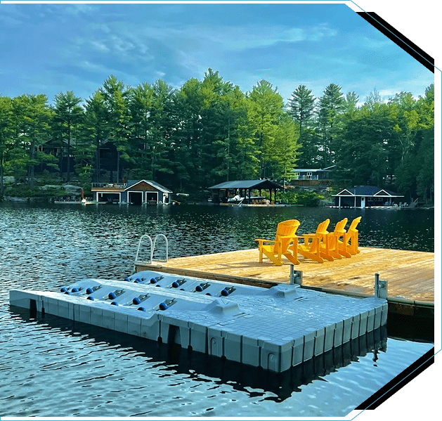 Group 5 (5) A dock with chairs on the water and trees in background.