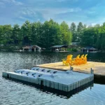 A dock with chairs on the water